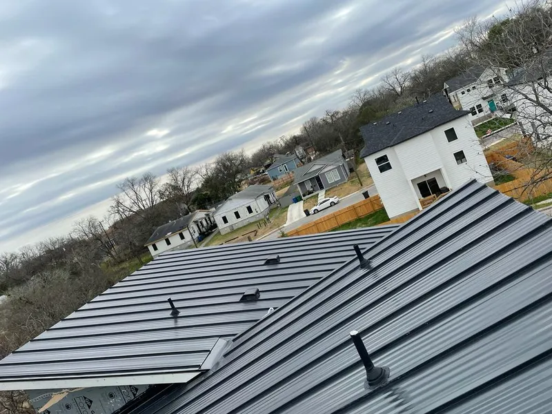 Standing seam metal roof panels with vents for Skylight Repair in Windham